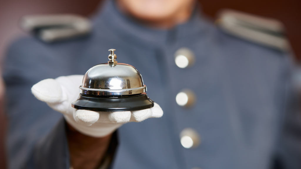 Concierge with a bell to ring for a chiropractic concierge service