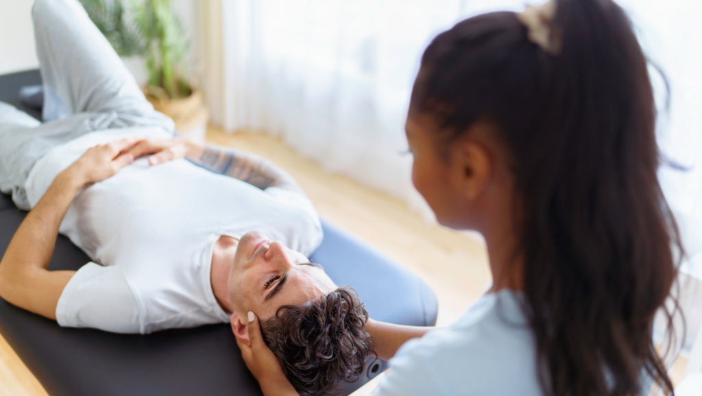 Chiropractor at the Embassy Gardens Giving Adjustment.