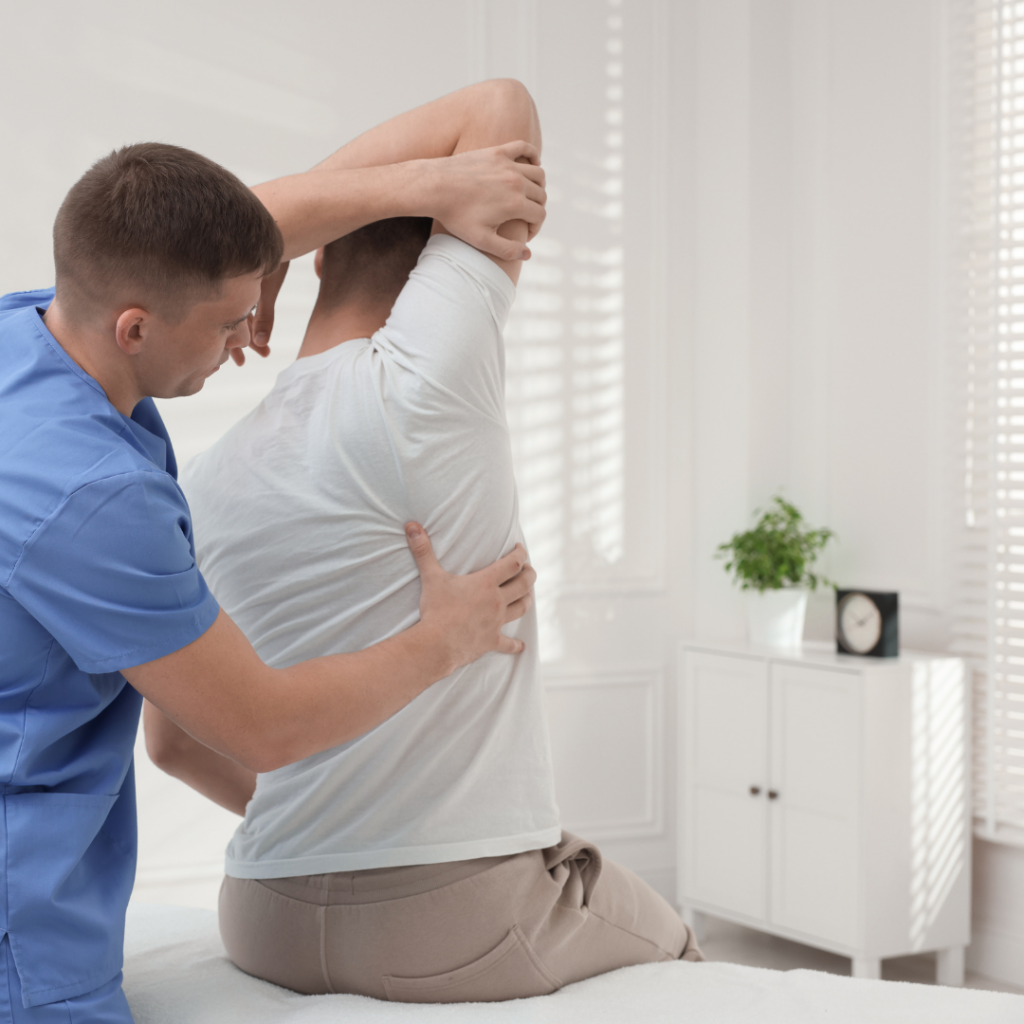 Chiropractor from Nine Elms Chiropractic doing a home visit for a patient, the chiropractic concierge service.