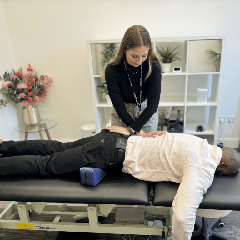 Physiotherapy Nine Elms physio having a treatment on a patients lower back